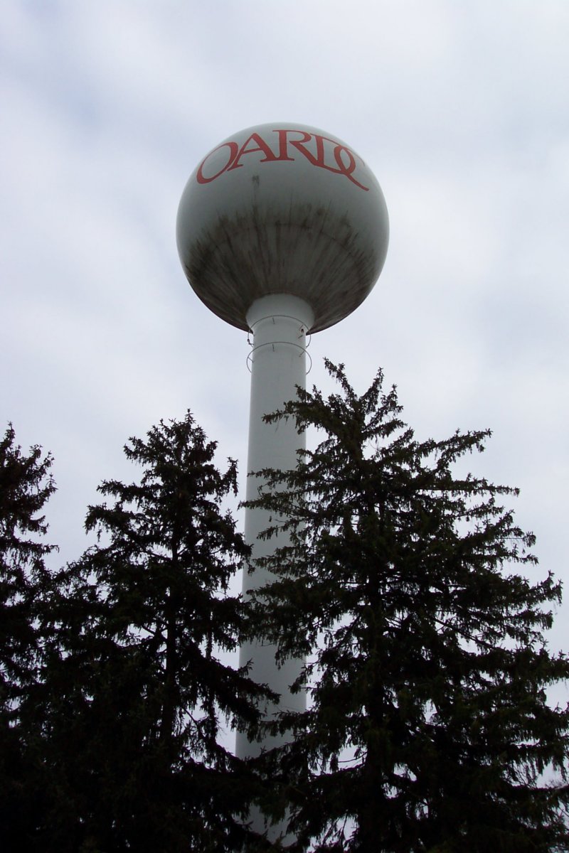 awaterstoragetowerwithoardcwrittenalloverit.jpg